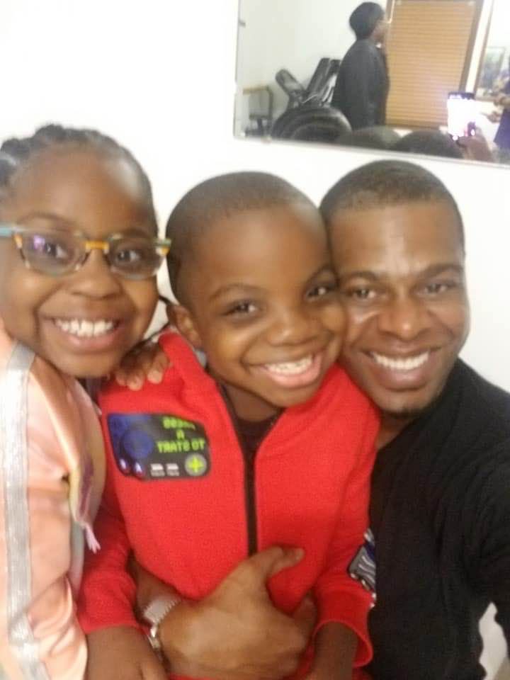 Tony with his young cousins — love in action